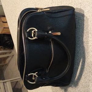 Black handbag with gold accents.